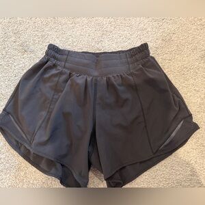 Black Lululemon Hotty Hot 4in shorts. Size 4